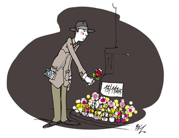 Un détective dépose une fleur devant un plaque 13/11/2015